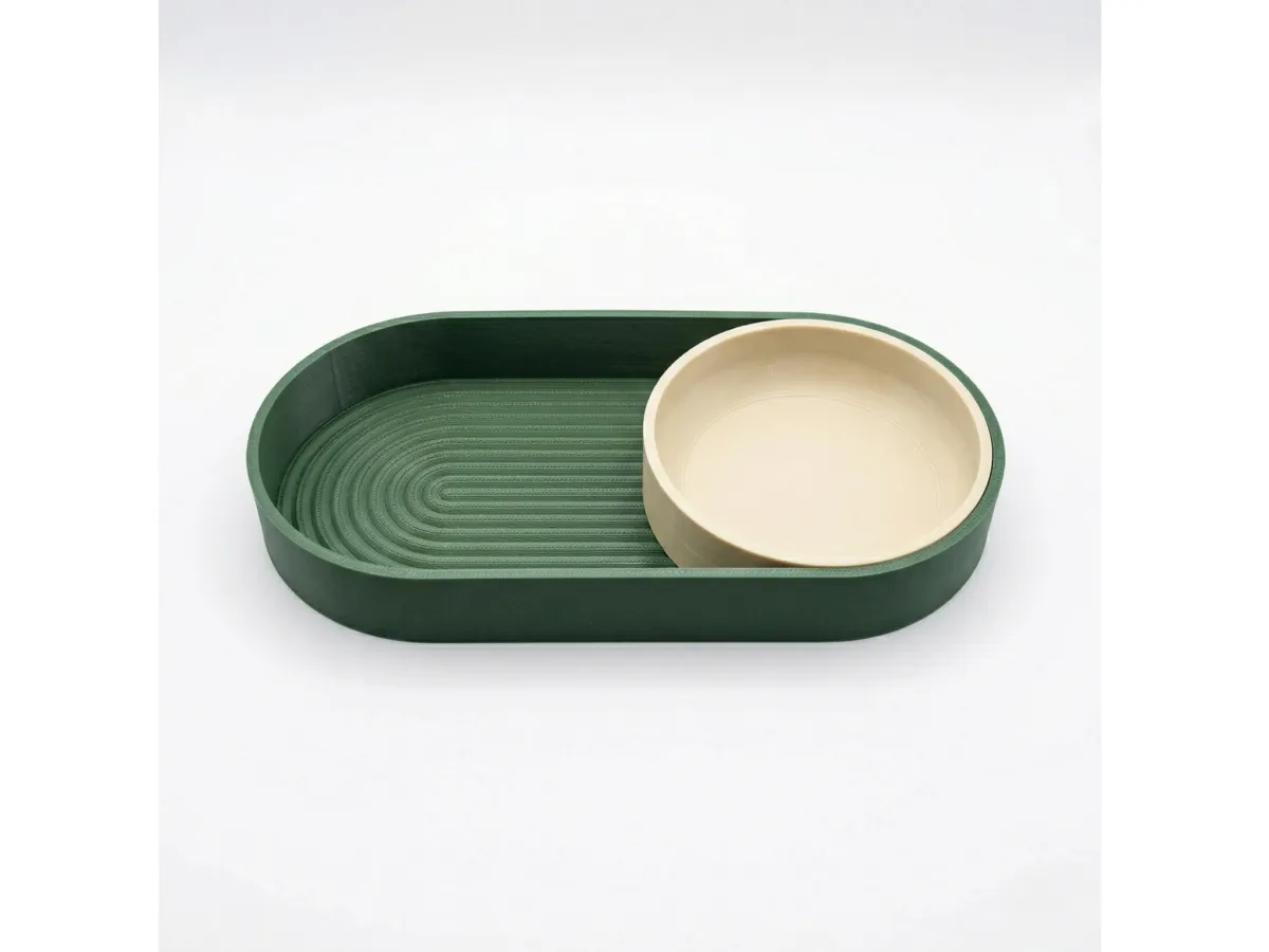 Visualización de bandeja verde con recipiente circular beige